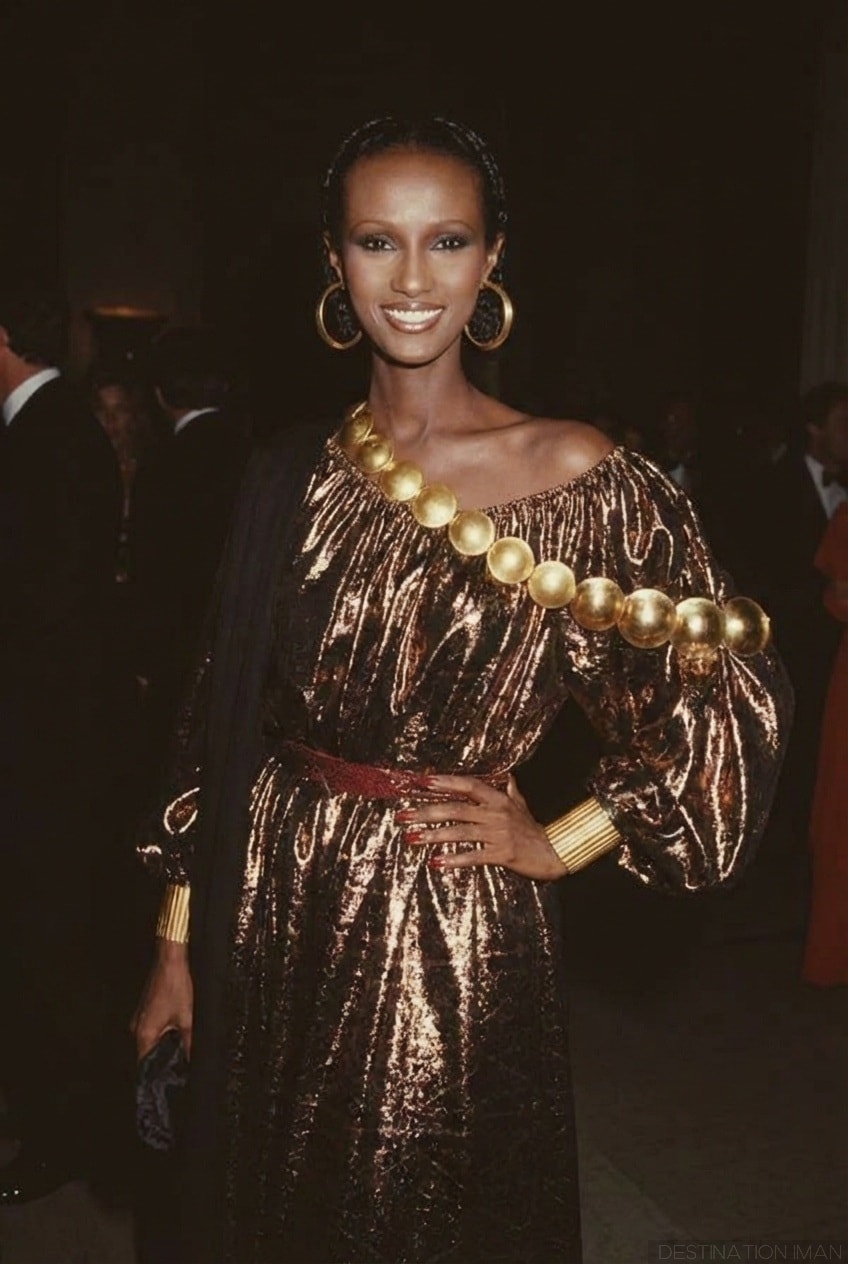Iman at the 1981 Met Gala wearing a shimmering Calvin Klein gown with sculptural gold details